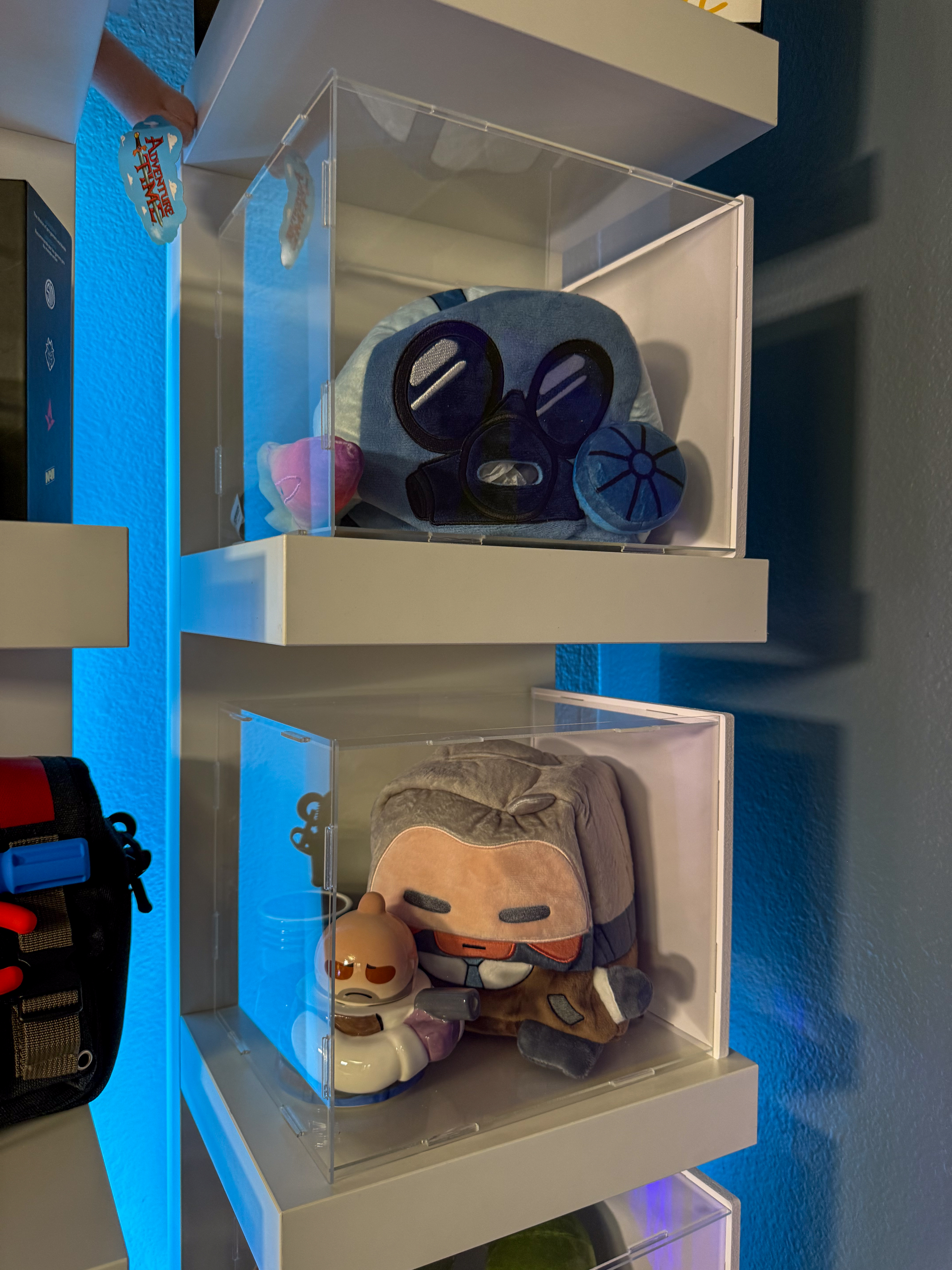 Top sehlf ct tissue box and skeleton fade plushie, nottom shelf agent K tissue box and agent K teapot set